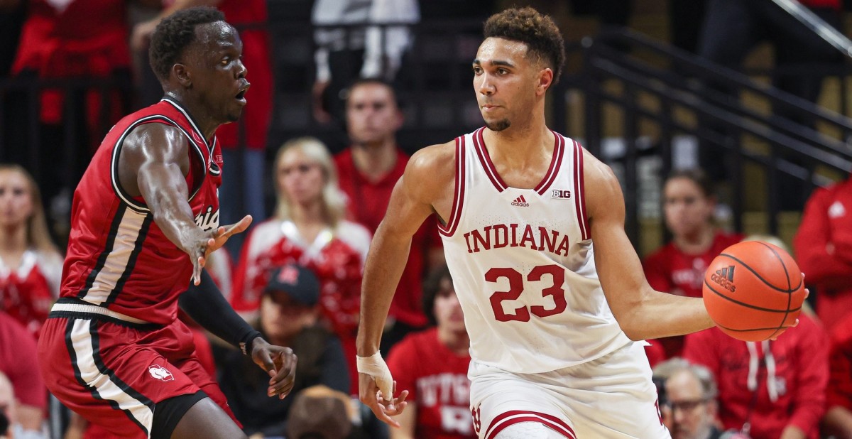 Indiana forward Trayce Jackson-Davis (23) passes the ball against Rutgers forward Mawot Mag (3) on Saturday. (Vincent Carchietta-USA TODAY Sports)